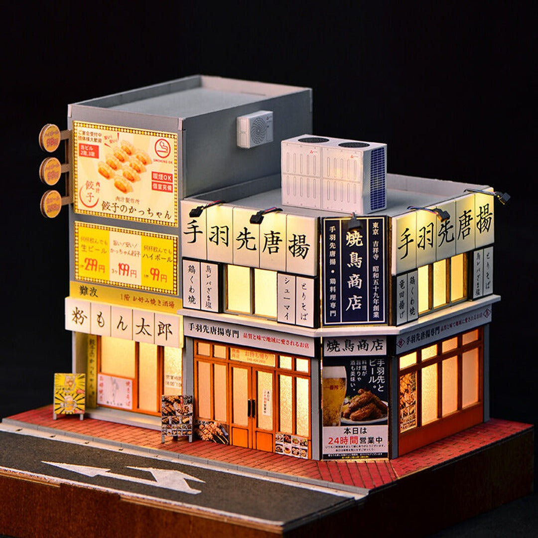 DIY Miniature Japanese Street Corner Shop House Kit lit up night scene with diecast cars