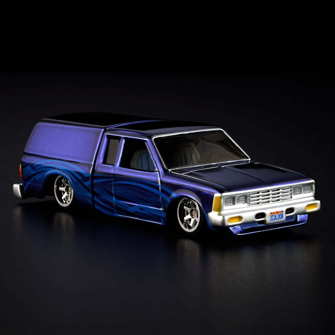 Hot Wheels RLC 1986 Nissan 720 King Cab 1:64 Diecast Model Car - Front Three-Quarter View with ICULOOK Plate