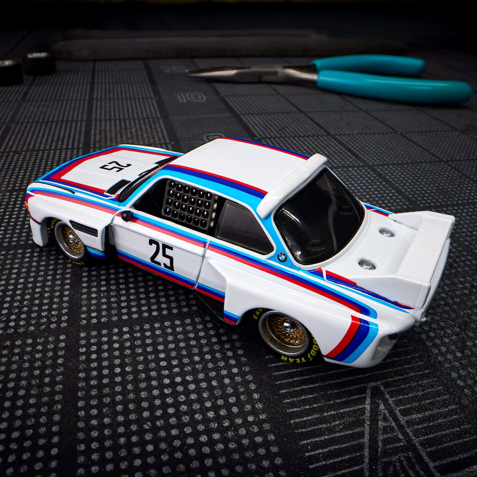 Hot Wheels Scale 1:64 Imported Elite 64 1975 BMW 3.0 CSL Race Vehicle Exclusive Collection