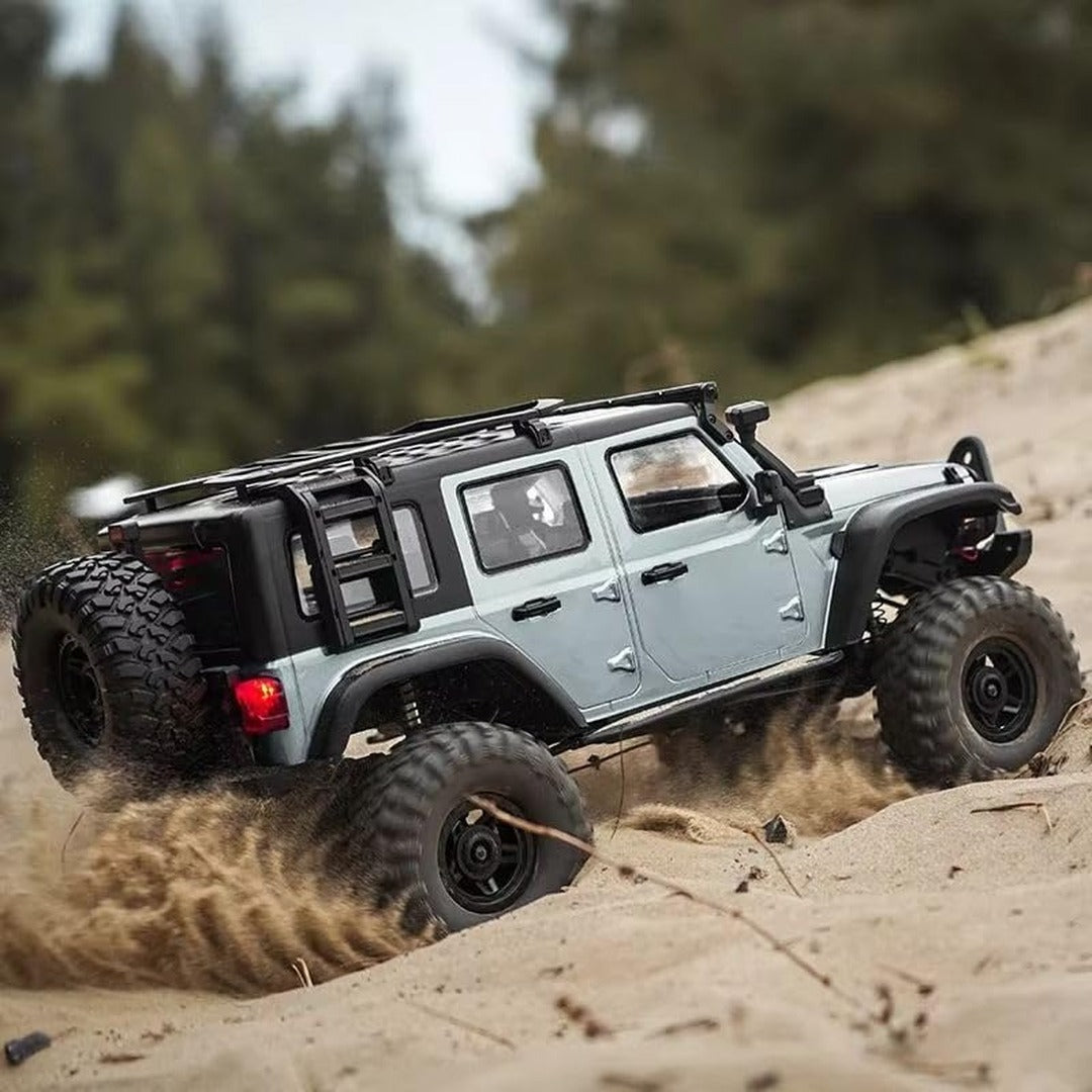 RC Jeep Wrangler Rock Crawler driving through sand