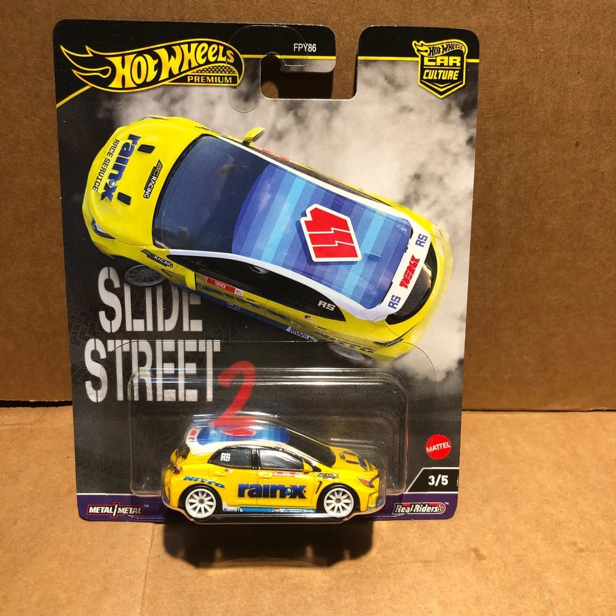 1:64 Hot Wheels 2024 Slide Street 2 (Real Drift Cars)- Premium Pop Culture Series H Diecast Model Cars - 2023 Toyota GR Corollo Yellow