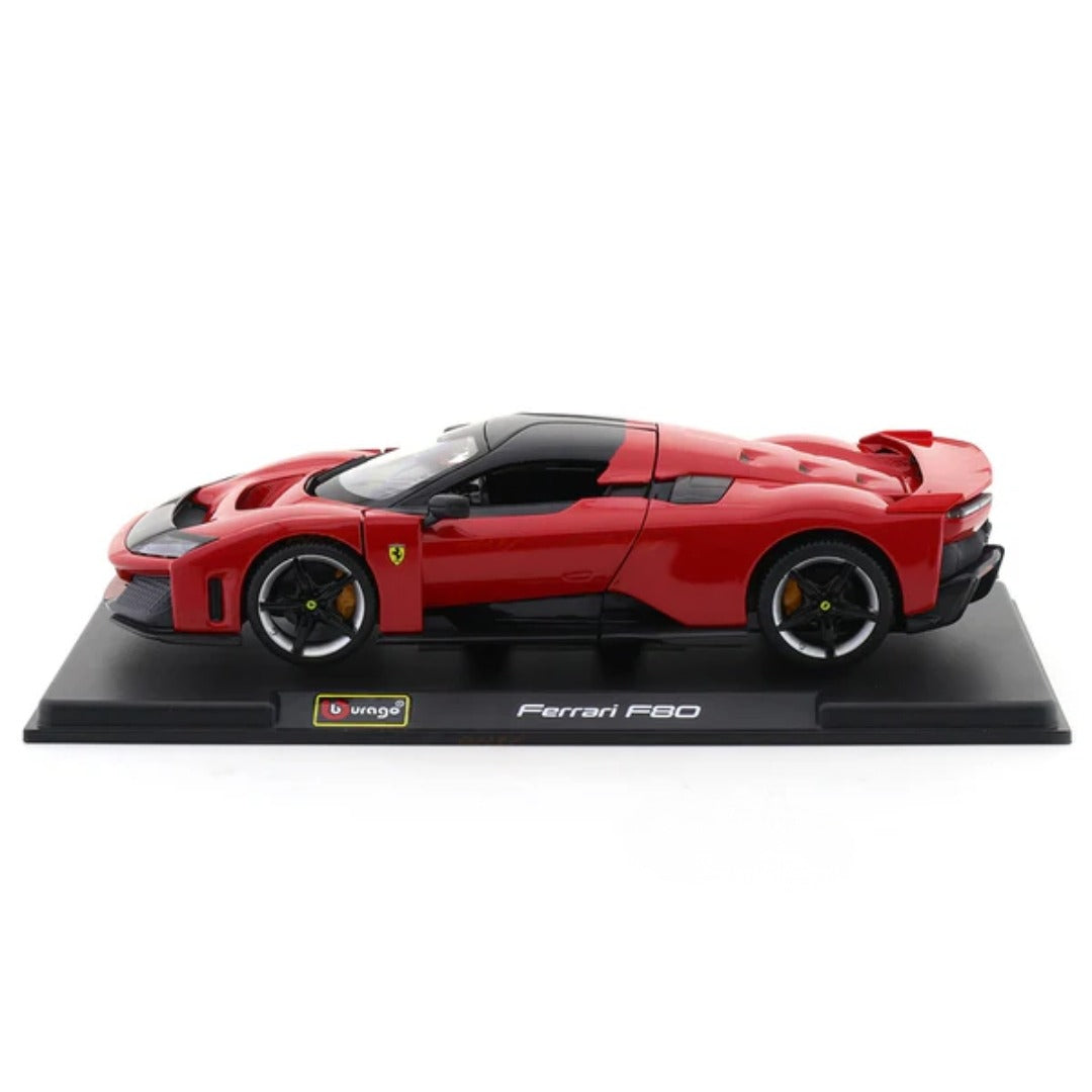 Model of a red Ferrari F80 on a black base with a white background