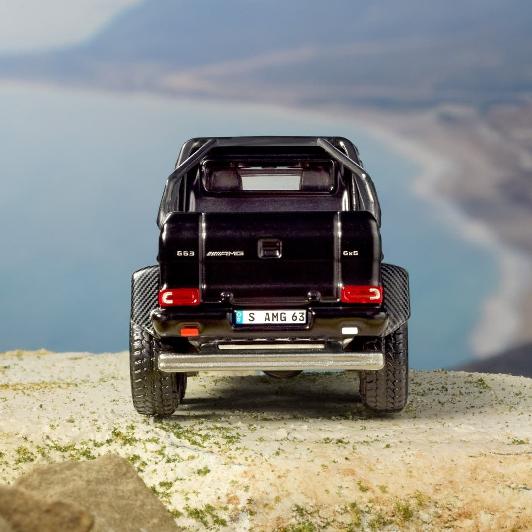 Hot Wheels Elite Mercedes-Benz G 63 AMG 6x6 1:64 Diecast Model Car - Rear View on Cliff