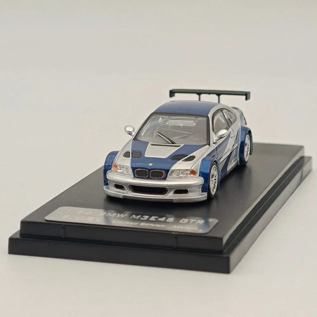 PRE-ORDER Ghost Player BMW M3 E46 GTR Blue Silver 1:64 diecast model car, front three-quarter view on display base